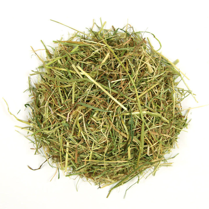 Nature's Own Devon Meadow Hay: loose pile showing long, green meadow hay