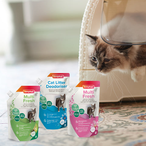 Beaphar Cat Litter Deodoriser range beside a cat at its litter box
