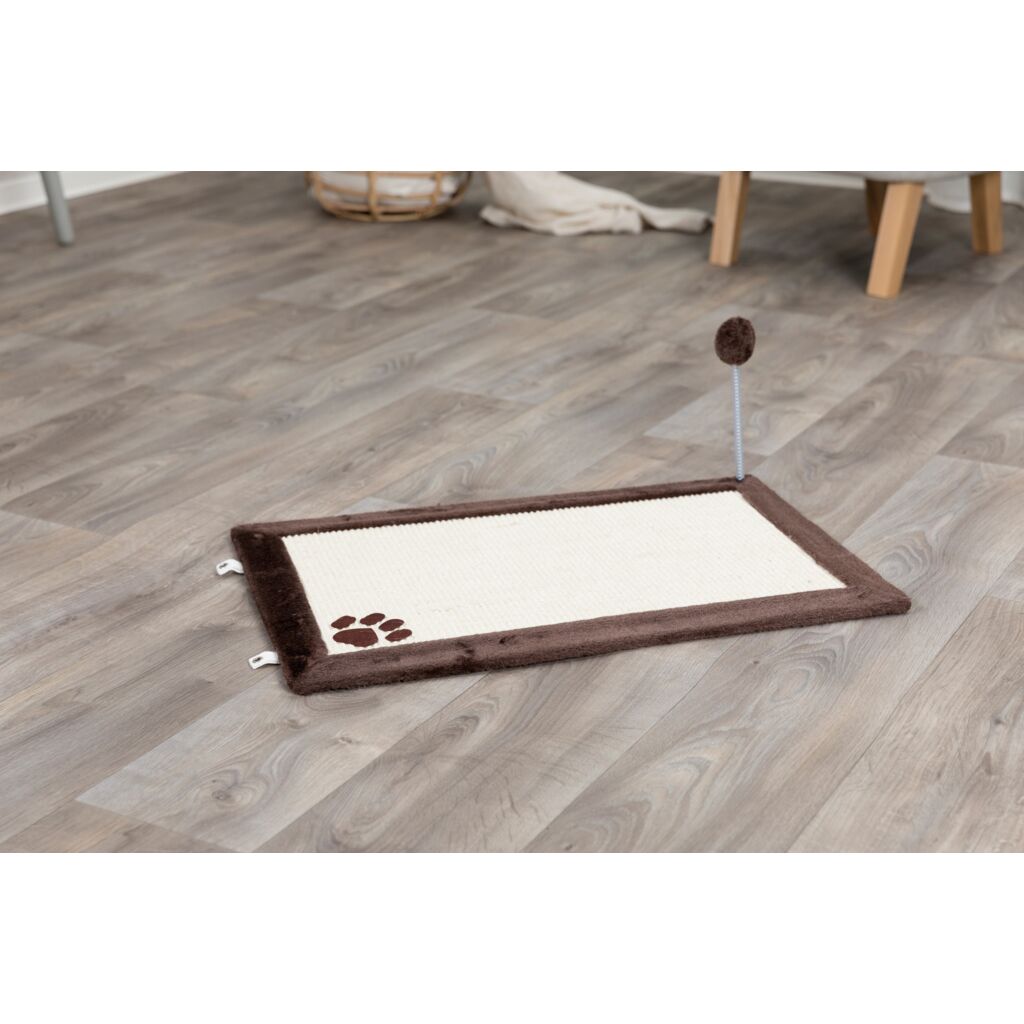 Trixie Cat Scratching Mat with brown plush border and ball toy lying on a wooden floor
