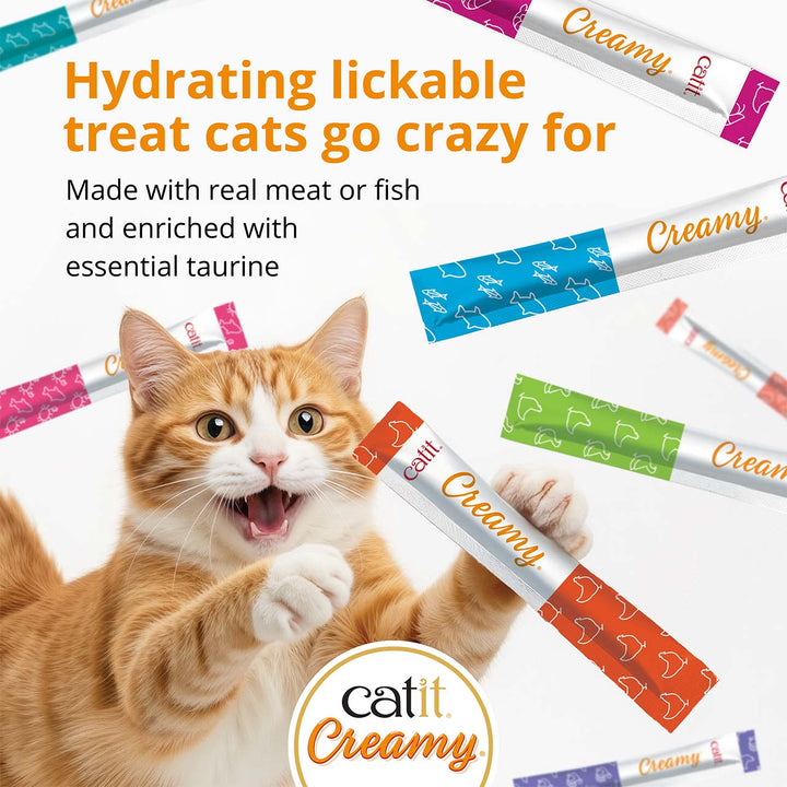 Cat reaching for a Catit Creamy tube: hydrating lickable treat made with real meat or fish and taurine