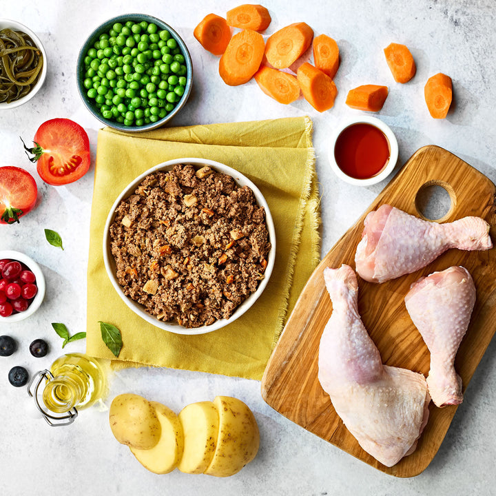 Naturo Chicken with Potato and Vegetables served in a bowl with chicken, potato, carrots, peas and tomato ingredients
