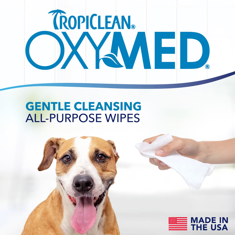 TropiClean OxyMed gentle cleansing all purpose wipes being used on a dog