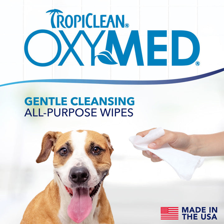 TropiClean OxyMed gentle cleansing all purpose wipes being used on a dog