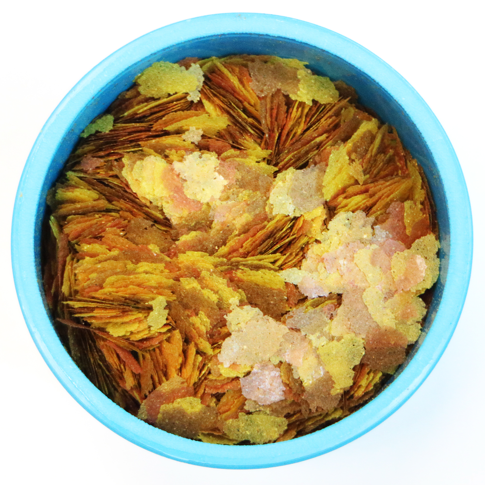 Aquarian Goldfish Flake Food open tub showing the flakes